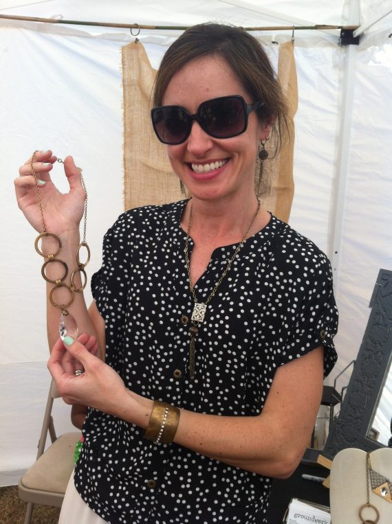 Catenya McHenry captures a photo of Alabama vintage jewelry designer Sara Hart holding a recycled necklace.