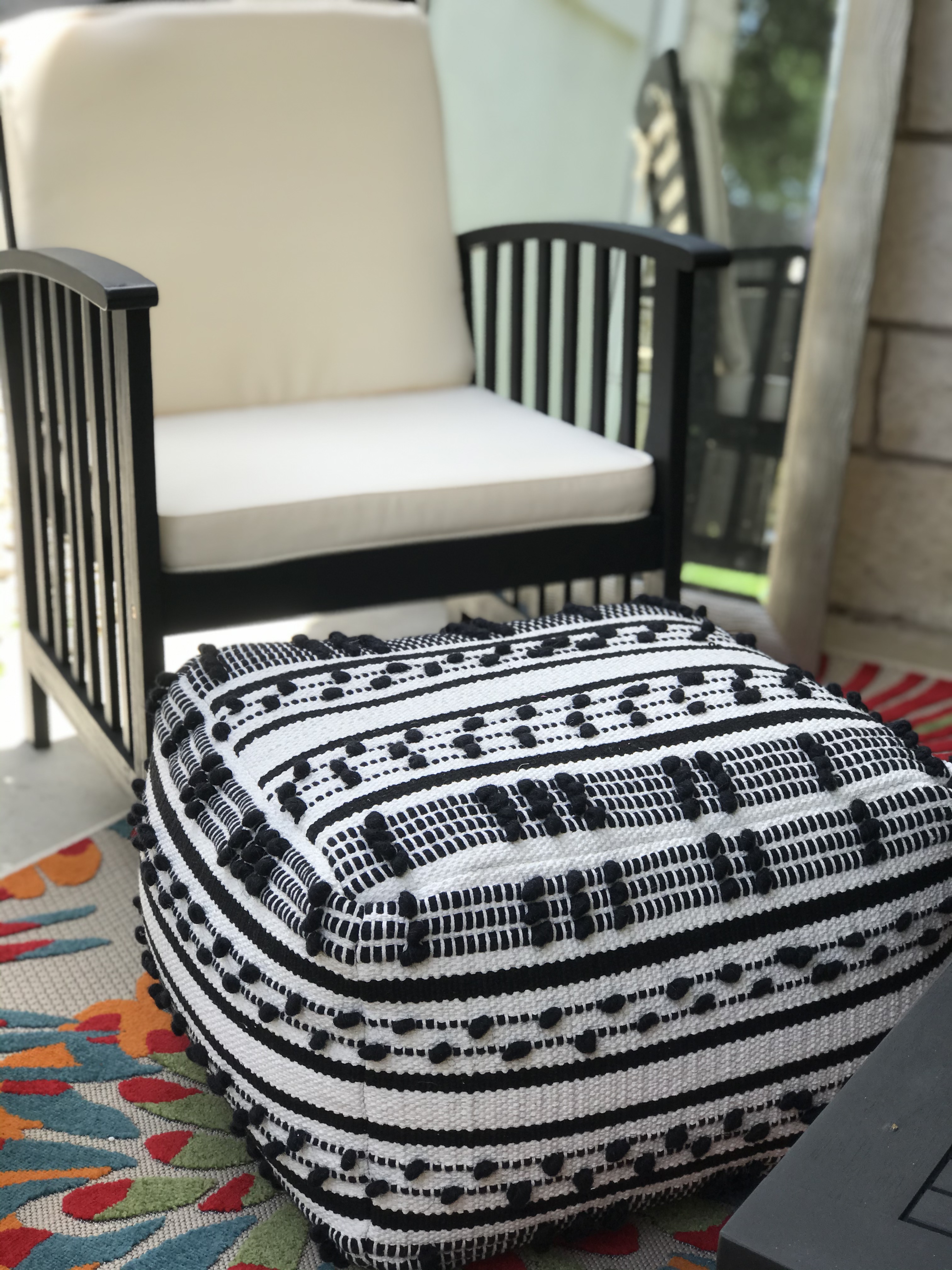 ReStylist Catenya McHenry creates an outdoor space by adding the Lory Pouf Black Textured from Opalhouse at Target