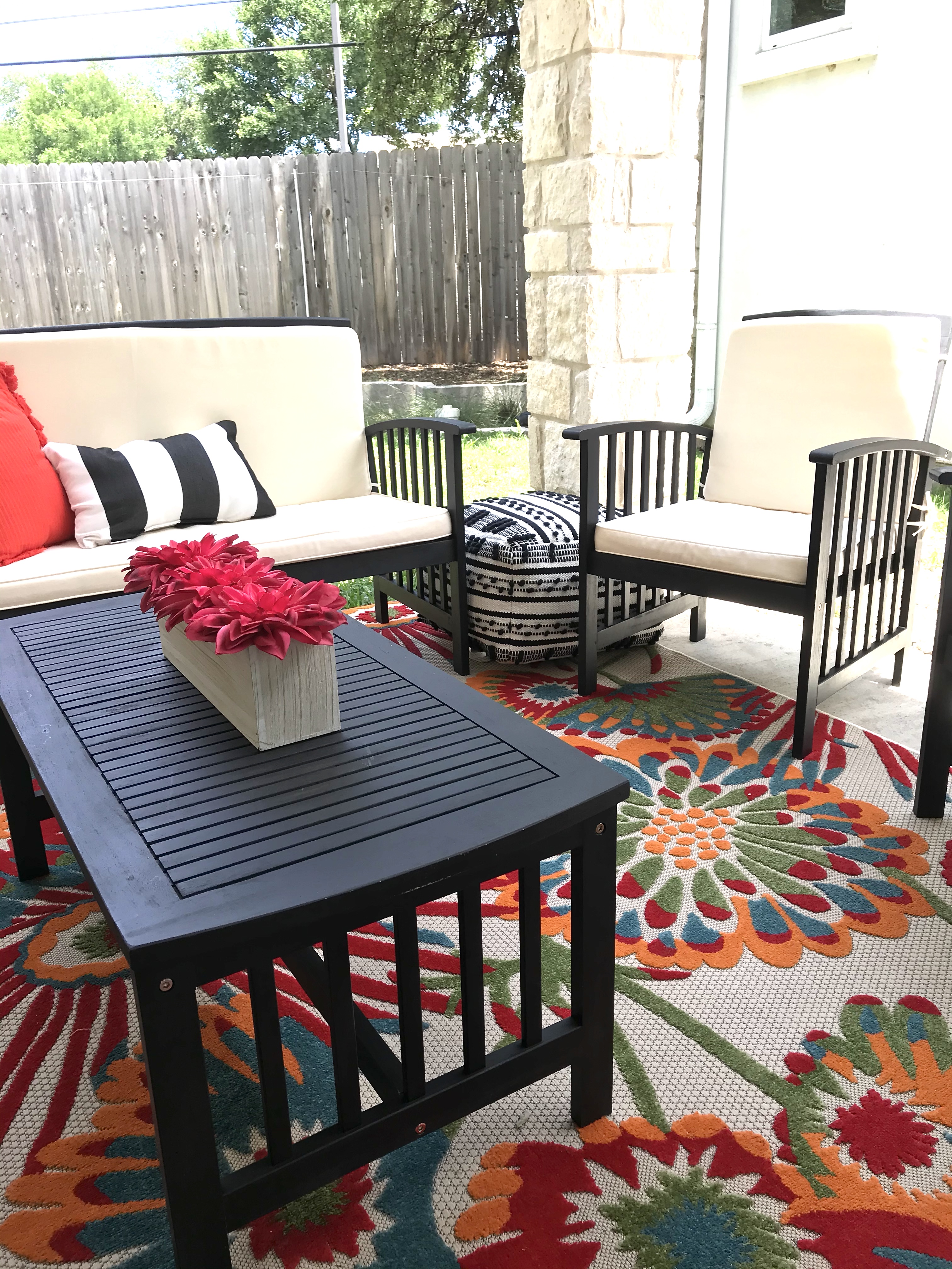 ReStylist Catenya McHenry creates an outdoor space by adding a floral centerpiece from Home Goods