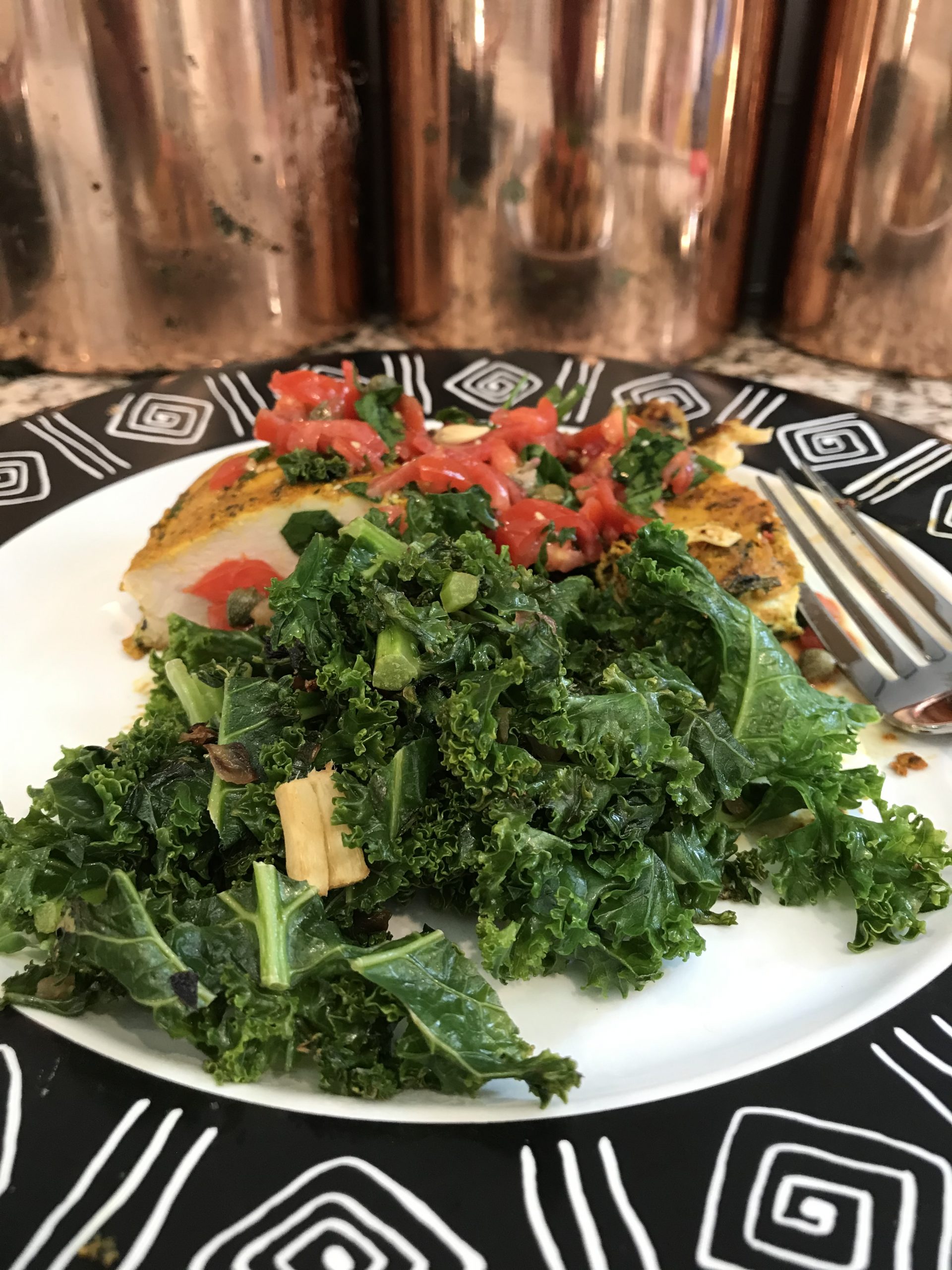 On season 2, episode 1 of The Mom Who Can't Cook show, Catenya McHenry cooks Aromatic Chicken breast with kale, red onions, and a tomato and chili salsa from The SirtFood Diet cook book.